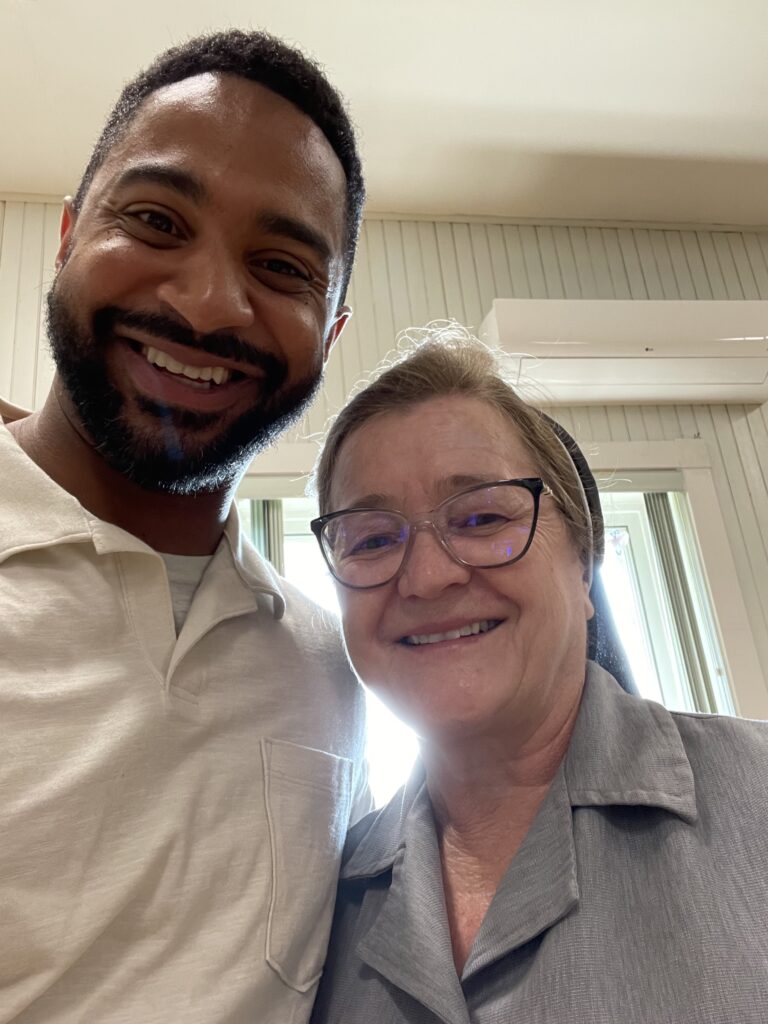 picture of Yan Garcia and ESL student smiling after class